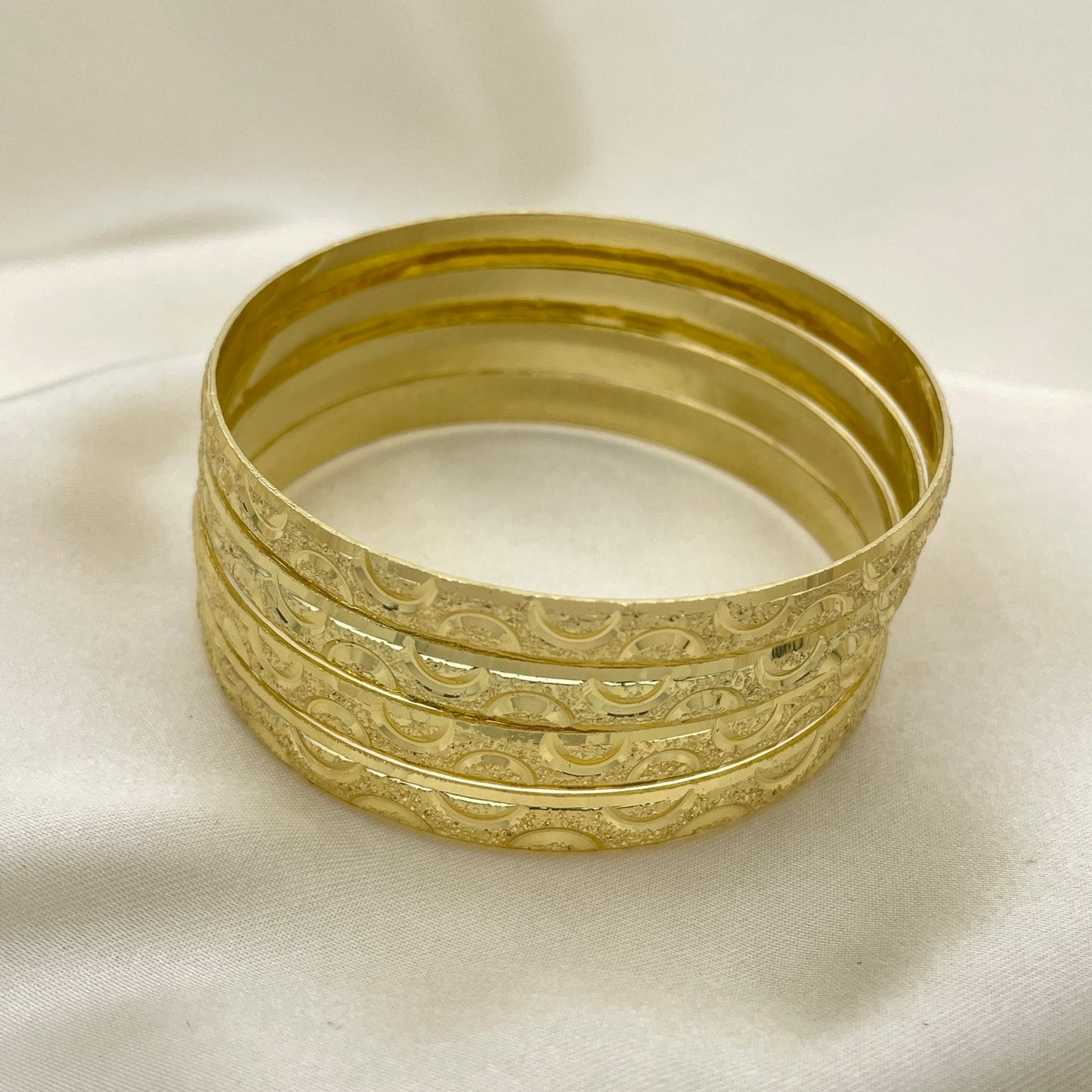 Bangle bracelets, three tones